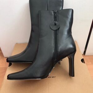 Sleek Black Leather Heeled Boots